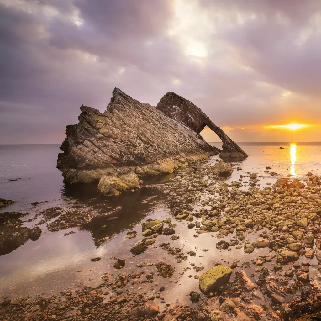Bow Fiddle rock in Scotland. taken early in the morning as the sun rises. Image by Torin Liversedge.